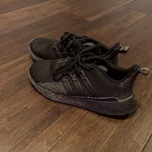 All black Adidas shoes
